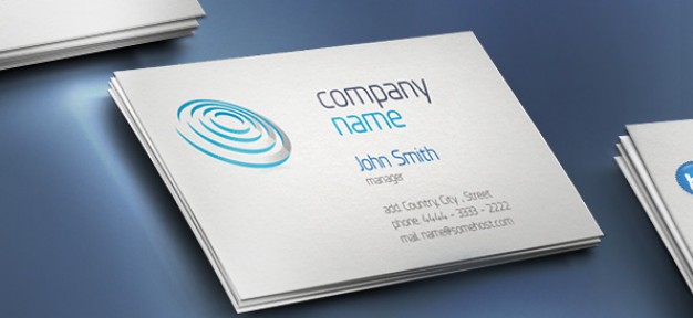 creative business card with company name over blue surface