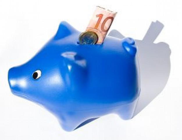 blue plastic piggy bank with paper money