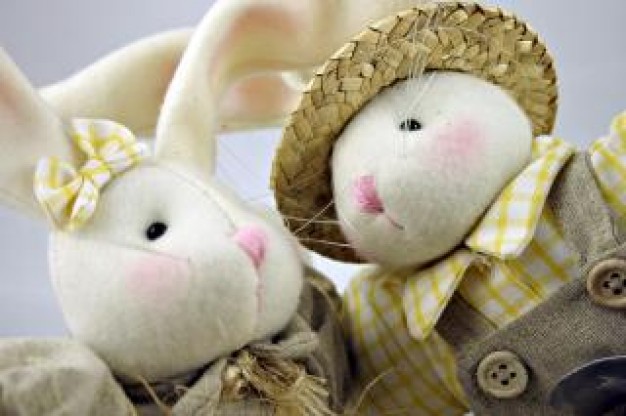 easter rabbits toy with grass hat closeup stuffed