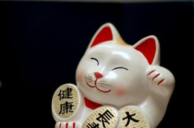 lucky cat china over dark background