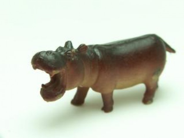 plastic hippopotamus in brown portrait