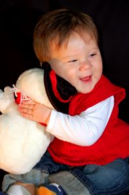 snowman toy and happy boy with red clothing