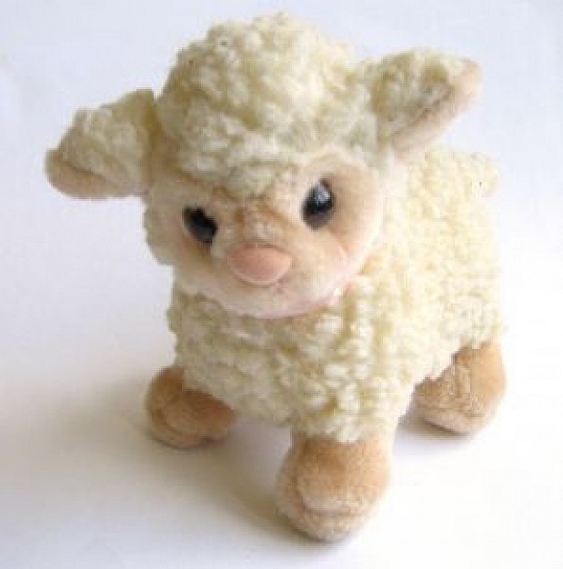 toy sheep with white hair over white surface