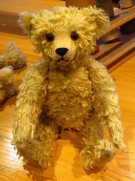 bear toy with stuffed steiff on the table