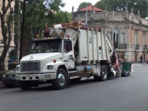 garbage car gathering rubbish at the street