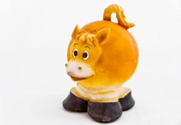 golden piggy bank cow standing on the stump cartoon