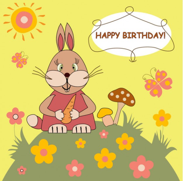 rabbit on a hill holding a carrot for birthday card