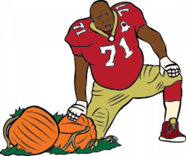 Football Man with red t-shirt standing at side of two pumpkins